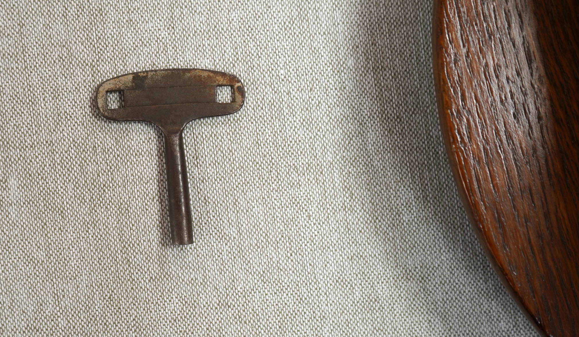 A GWR mahogany wall timepiece by Smiths, Made in Great Britain, with 8” painted dial marked Cardiff and separate seconds dial within the chapter ring, platform escapement, ivorine plaque engraved with ‘BR-WR 3952’ to the